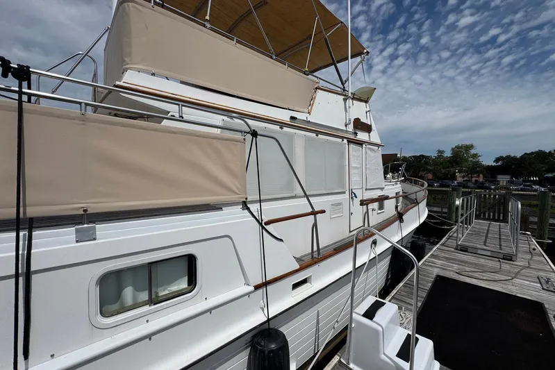 Carolina Breeze Yacht Photos Pics 1989 Grand Banks 42 Motor Yacht docked, featuring classic design and spacious deck.