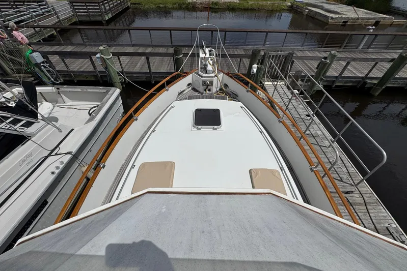 Carolina Breeze Yacht Photos Pics 1989 Grand Banks 42 Motor Yacht docked at marina, top deck view.