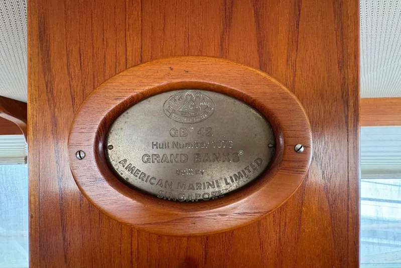 Carolina Breeze Yacht Photos Pics Plaque on 1989 Grand Banks 42 Motor Yacht, displaying hull number and manufacturer details.