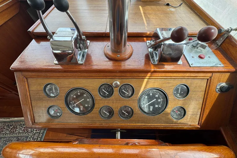 Carolina Breeze Yacht Photos Pics Control panel of a 1989 Grand Banks 42 Motor Yacht with gauges and levers.