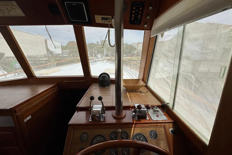 Carolina Breeze Yacht Photos Pics Interior helm of 1989 Grand Banks 42 Motor Yacht with wooden dashboard and controls.