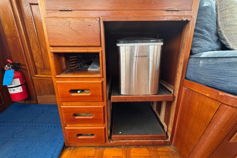 Carolina Breeze Yacht Photos Pics Wooden cabinetry with drawers and Frigidaire appliance on 1989 Grand Banks 42 Motor Yacht.