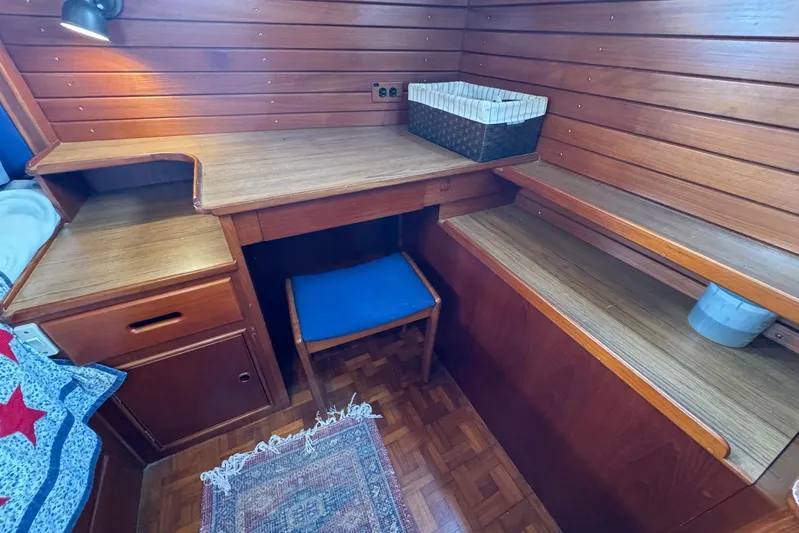 Carolina Breeze Yacht Photos Pics Cozy wooden interior of 1989 Grand Banks 42 Motor Yacht with desk and chair.