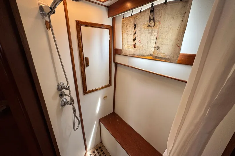 Carolina Breeze Yacht Photos Pics Shower area in 1989 Grand Banks 42 Motor Yacht with wooden accents and nautical decor.