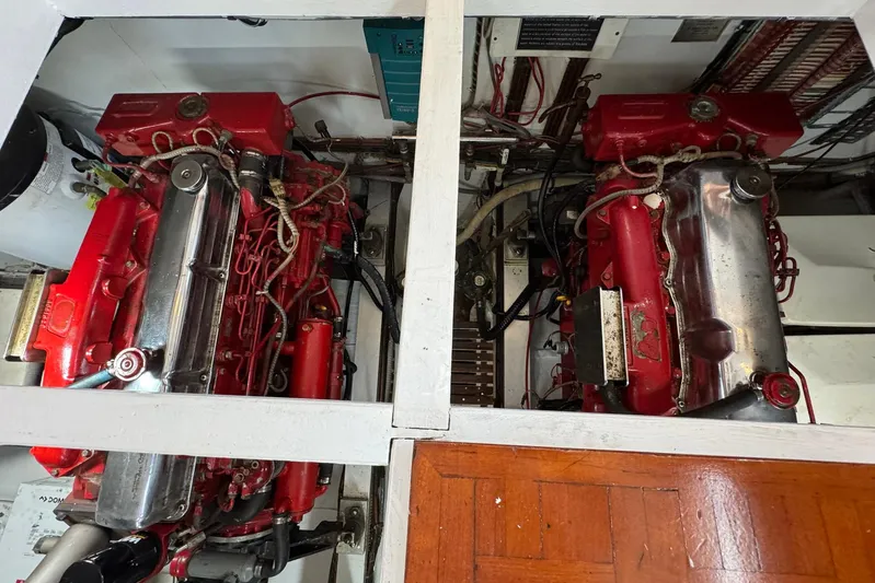 Carolina Breeze Yacht Photos Pics Engine room of 1989 Grand Banks 42 Motor Yacht with twin red engines.