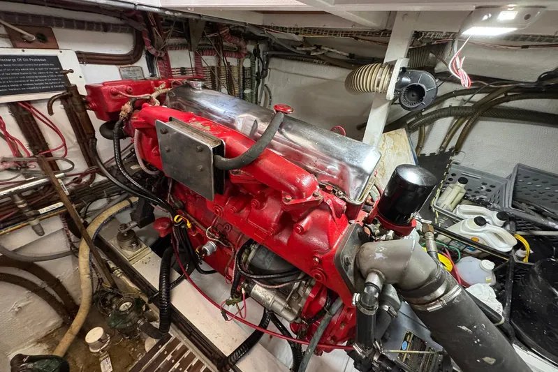 Carolina Breeze Yacht Photos Pics Engine room of a 1989 Grand Banks 42 Motor Yacht, featuring a red engine.