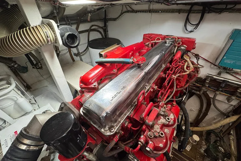 Carolina Breeze Yacht Photos Pics Engine room of 1989 Grand Banks 42 Motor Yacht with red engine components.