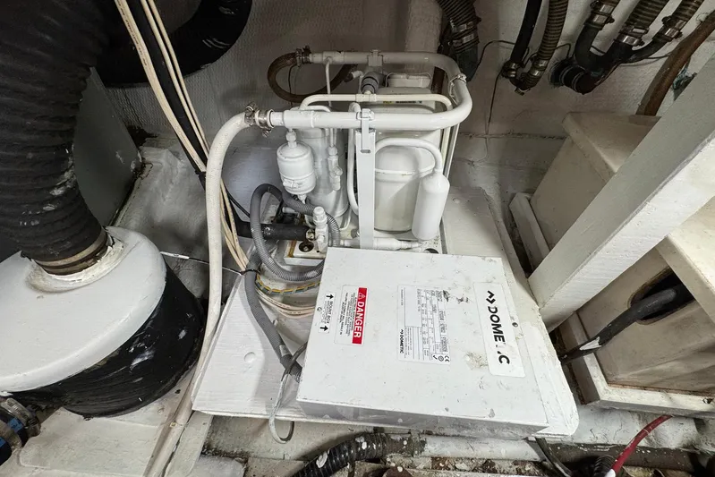 Carolina Breeze Yacht Photos Pics Engine room of 1989 Grand Banks 42 Motor Yacht with mechanical components.