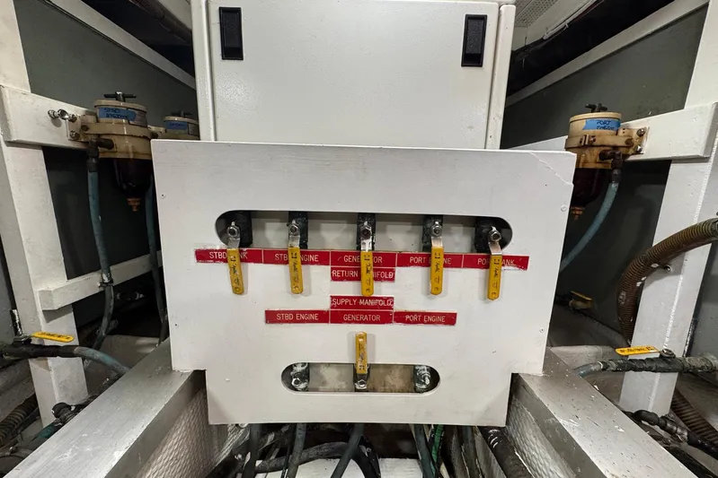 Carolina Breeze Yacht Photos Pics Engine room of 1989 Grand Banks 42 Motor Yacht with fuel manifold controls.