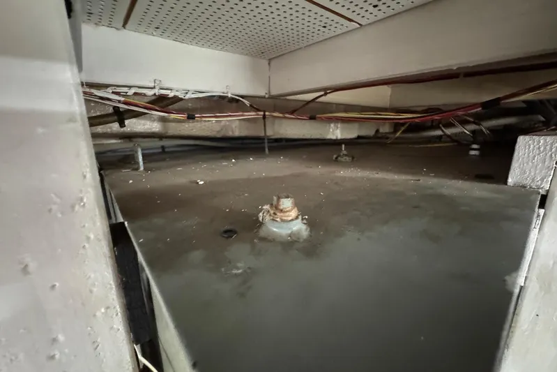 Carolina Breeze Yacht Photos Pics Bilge area of a 1989 Grand Banks 42 Motor Yacht, showing wiring and structural components.