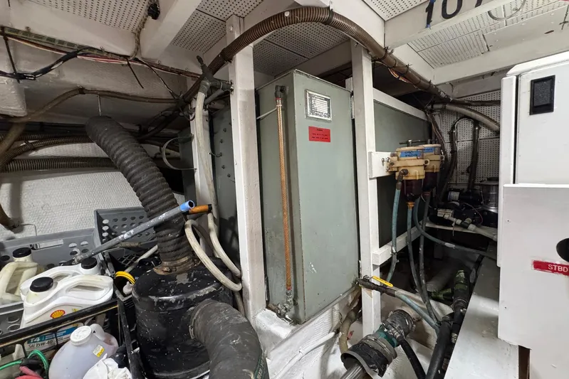 Carolina Breeze Yacht Photos Pics Engine room of a 1989 Grand Banks 42 Motor Yacht with various mechanical components.