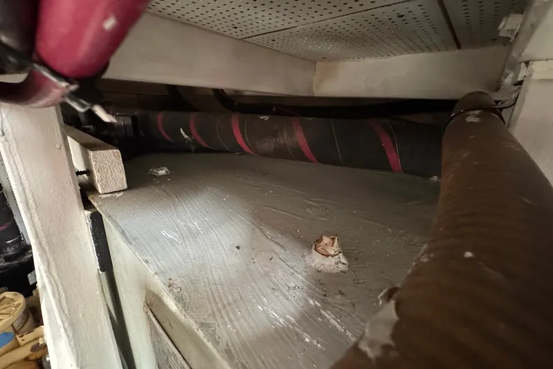 Carolina Breeze Yacht Photos Pics Engine room of 1989 Grand Banks 42 Motor Yacht showing pipes and fittings.