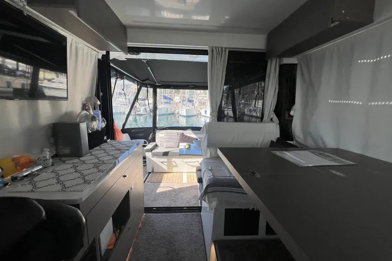  Yacht Photos Pics Interior of 2024 Jeanneau Merry Fisher 895, featuring modern design and marina view.