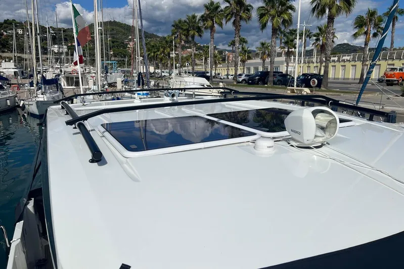  Yacht Photos Pics 2024 Jeanneau Merry Fisher 895 boat docked, showcasing sleek design and modern features.