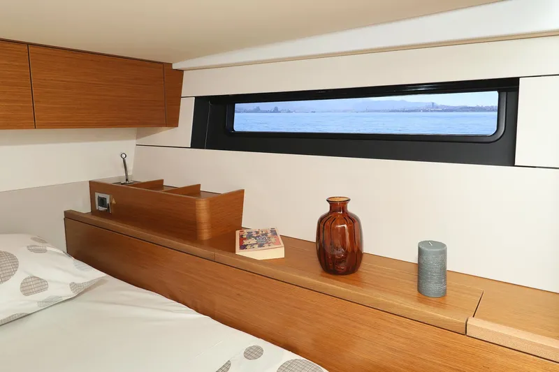 Volare Yacht Photos Pics Luxurious interior of 2025 Hanse 590 yacht with sea view window.