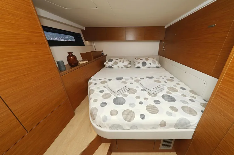 Volare Yacht Photos Pics Luxurious cabin interior of 2025 Hanse 590 yacht with modern wooden design.