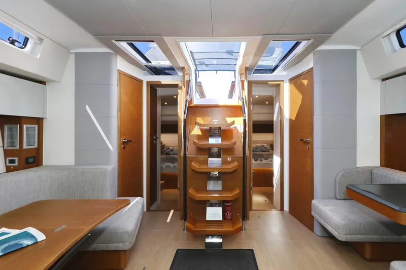 Volare Yacht Photos Pics Luxurious interior of 2025 Hanse 590 yacht with modern design and wooden finishes.