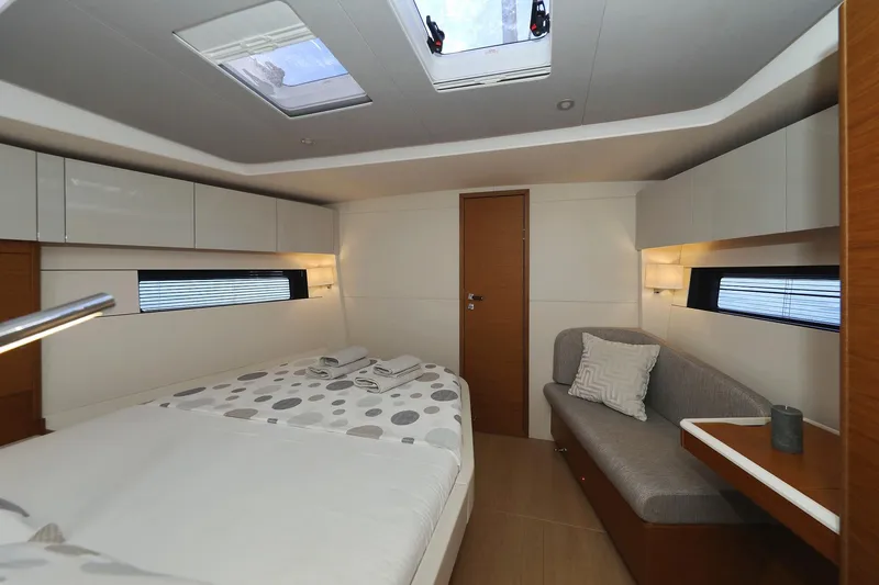 Volare Yacht Photos Pics Luxurious interior of 2025 Hanse 590 yacht with modern bedroom design.