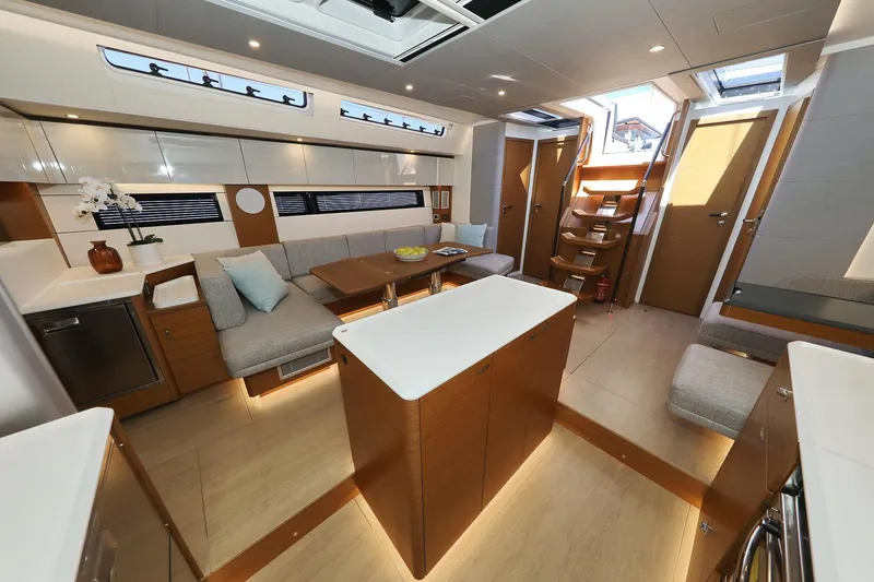 Volare Yacht Photos Pics Luxurious interior of 2025 Hanse 590 yacht with modern furnishings and elegant design.
