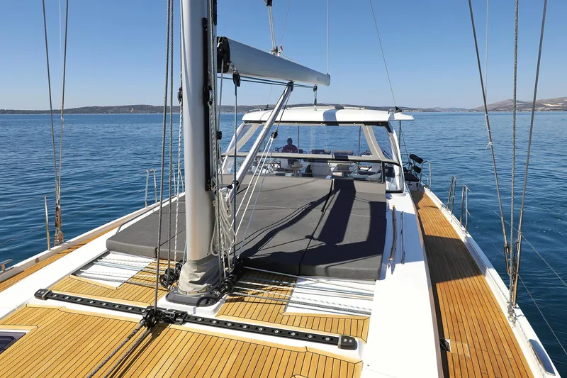 Volare Yacht Photos Pics 2025 Hanse 590 yacht with sleek deck design on calm blue waters.