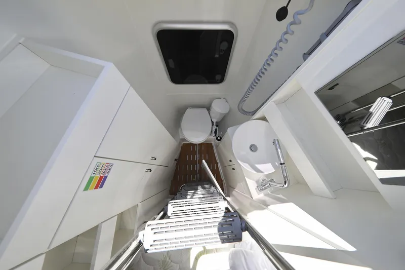 Volare Yacht Photos Pics Modern bathroom interior of 2025 Hanse 590 yacht, featuring sleek design and compact fixtures.