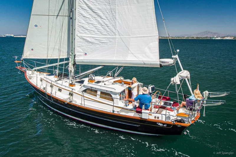Skoal Yacht Photos Pics 2005 Cabo Rico 42 Pilot sailboat cruising on open water under clear skies.