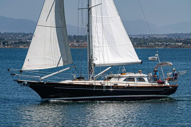 Skoal Yacht Photos Pics 2005 Cabo Rico 42 Pilot sailboat cruising on calm waters with crew onboard.