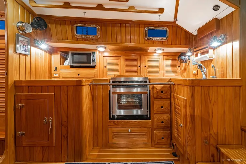 Skoal Yacht Photos Pics Luxurious wooden interior of 2005 Cabo Rico 42 Pilot yacht kitchen.