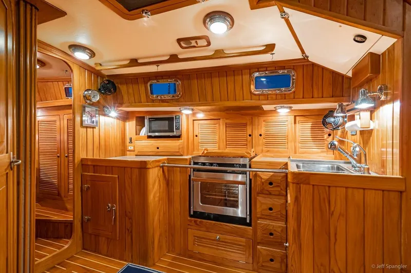 Skoal Yacht Photos Pics Luxurious wooden interior of 2005 Cabo Rico 42 Pilot yacht kitchen.