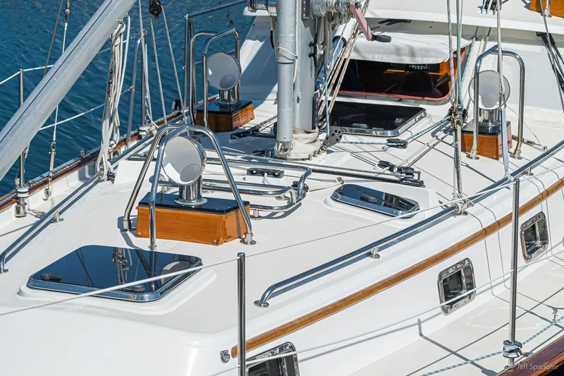 Skoal Yacht Photos Pics 2005 Cabo Rico 42 Pilot yacht deck with polished fittings and open hatch.