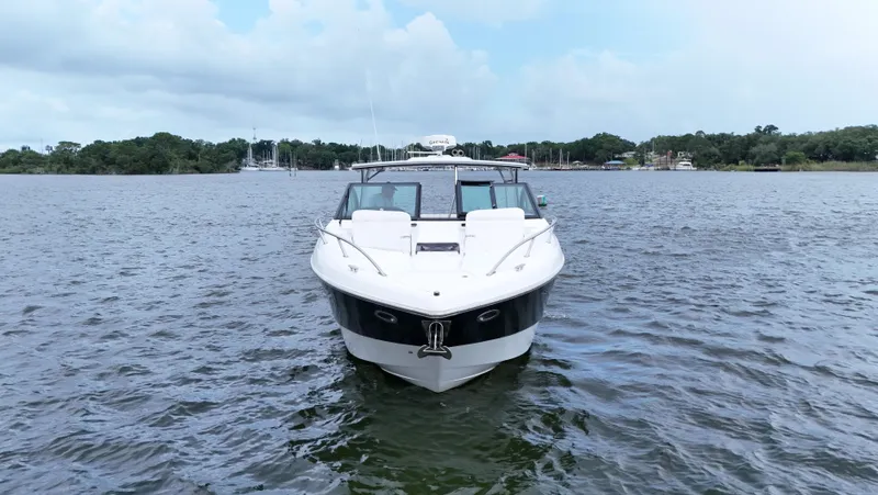  Yacht Photos Pics 2015 Cobalt A40 boat on calm water, front view, with scenic background.