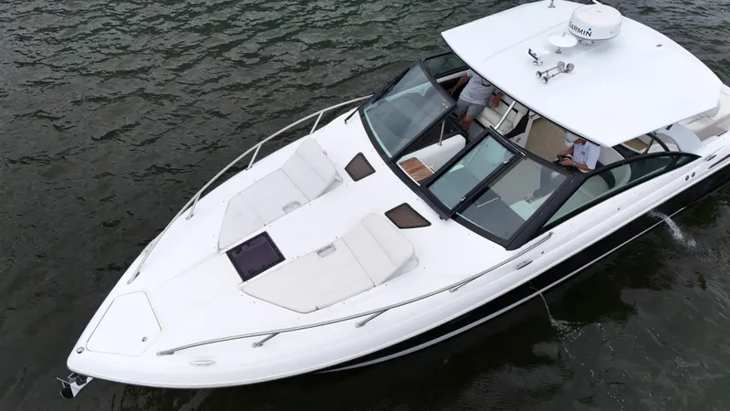  Yacht Photos Pics 2015 Cobalt A40 boat cruising on water, featuring sleek white design and spacious deck.