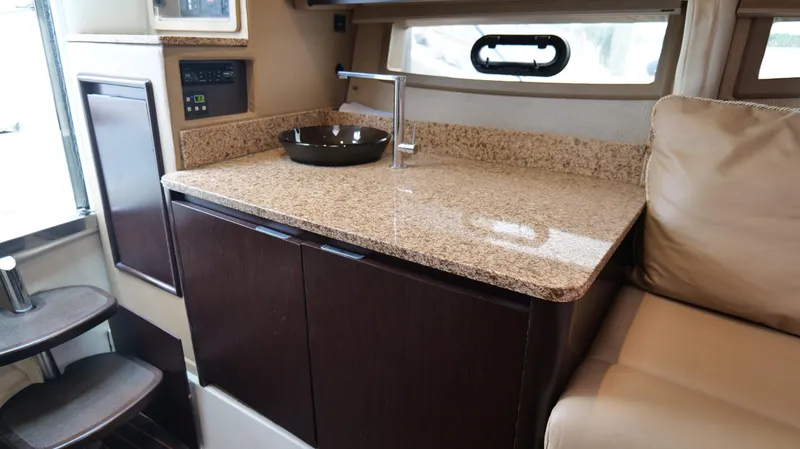  Yacht Photos Pics Luxurious interior of 2015 Cobalt A40 with granite countertop and modern sink.