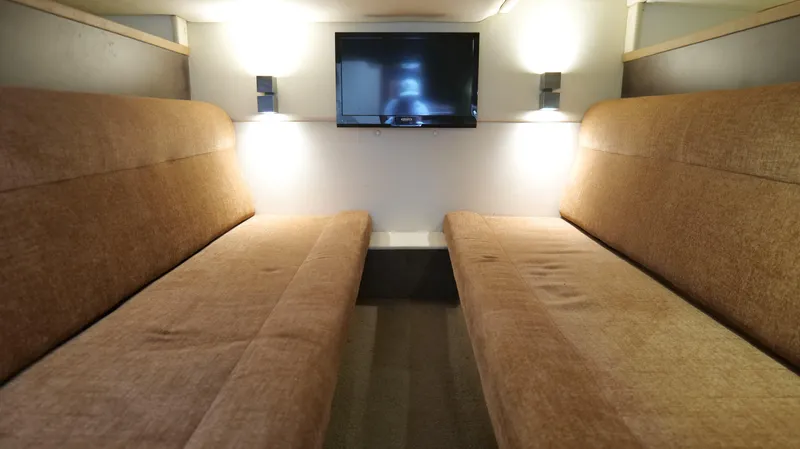  Yacht Photos Pics Interior of 2015 Cobalt A40 with twin sofas and wall-mounted TV.