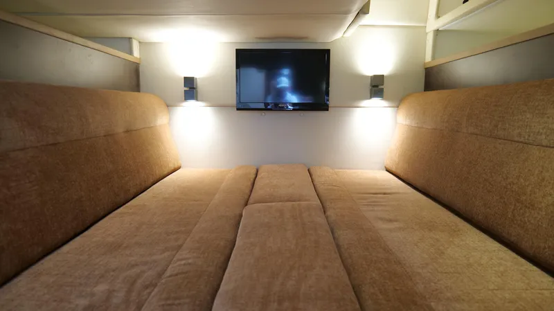  Yacht Photos Pics Luxurious interior of 2015 Cobalt A40 with cozy seating and wall-mounted TV.