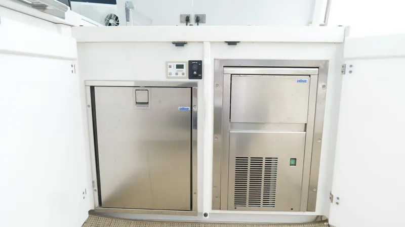  Yacht Photos Pics Stainless steel appliances on a 2015 Cobalt A40 boat interior.