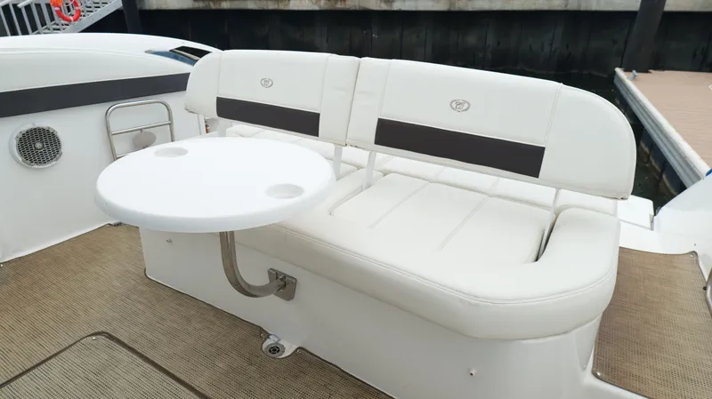  Yacht Photos Pics 2015 Cobalt A40 boat interior with white seating and round table.