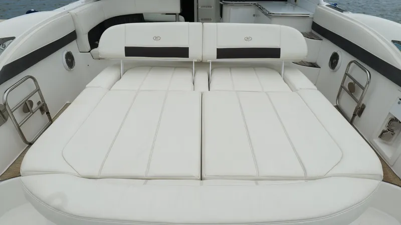  Yacht Photos Pics Luxurious seating area on a 2015 Cobalt A40 boat, featuring white cushioned upholstery.