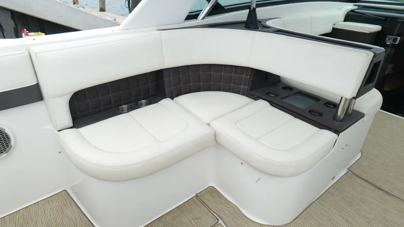  Yacht Photos Pics 2015 Cobalt A40 boat interior with white leather seating and cup holders.