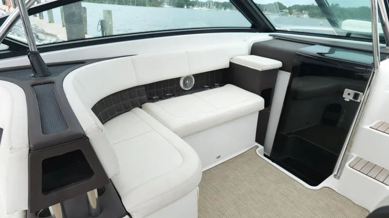  Yacht Photos Pics Interior of a 2015 Cobalt A40 boat with white seating and modern design.