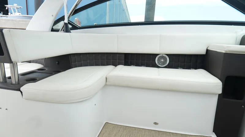  Yacht Photos Pics 2015 Cobalt A40 boat interior with white leather seating and speaker.