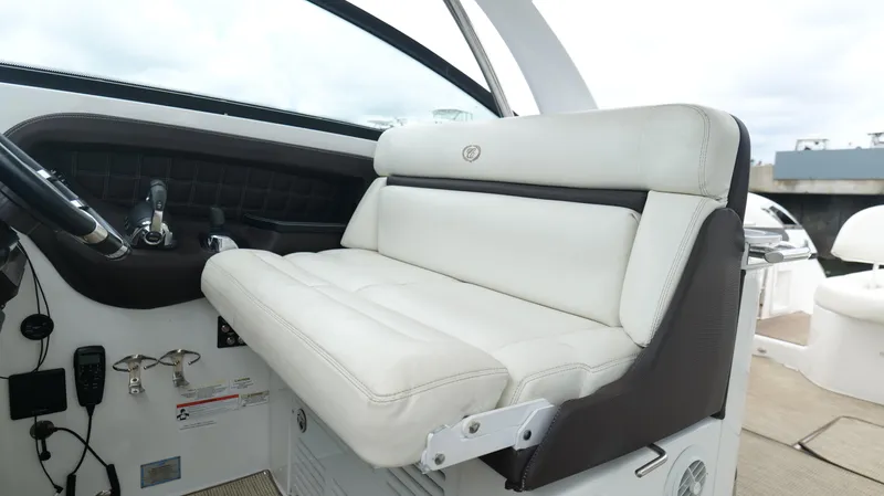  Yacht Photos Pics Luxurious white seating on 2015 Cobalt A40 boat, featuring sleek design and modern controls.