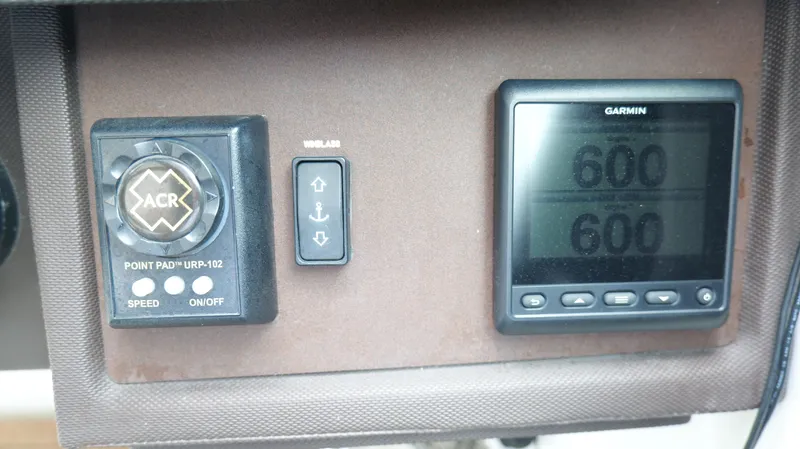  Yacht Photos Pics Control panel of a 2015 Cobalt A40 boat with Garmin display and ACR controls.