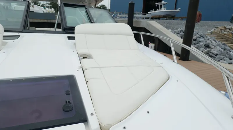 Yacht Photos Pics 2015 Cobalt A40 boat with white cushioned seating on deck.