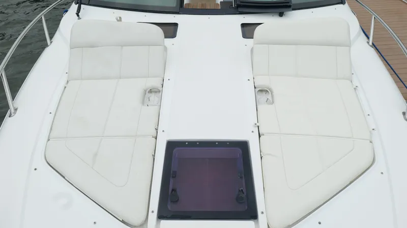  Yacht Photos Pics 2015 Cobalt A40 boat with white cushioned deck seating.