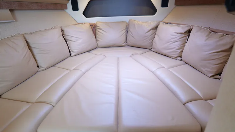  Yacht Photos Pics Luxurious beige seating area inside a 2015 Cobalt A40 boat cabin.