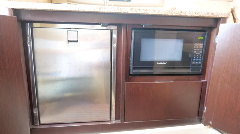  Yacht Photos Pics Built-in microwave and fridge in 2015 Cobalt A40 yacht kitchen.