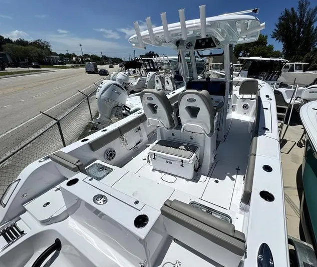  Yacht Photos Pics 2025 Sportsman Heritage 261 boat with dual seats, rod holders, and storage compartments.