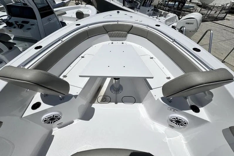  Yacht Photos Pics 2025 Sportsman Heritage 261 boat interior with seating and table, showcasing modern design.