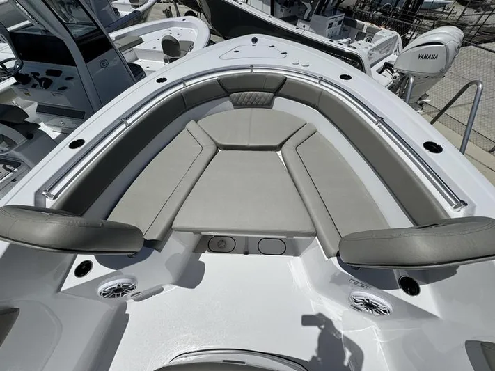  Yacht Photos Pics 2025 Sportsman Heritage 261 boat interior with cushioned seating and modern design.